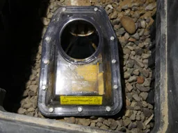 Backwater valve with inspection opening visible before the floor is restored